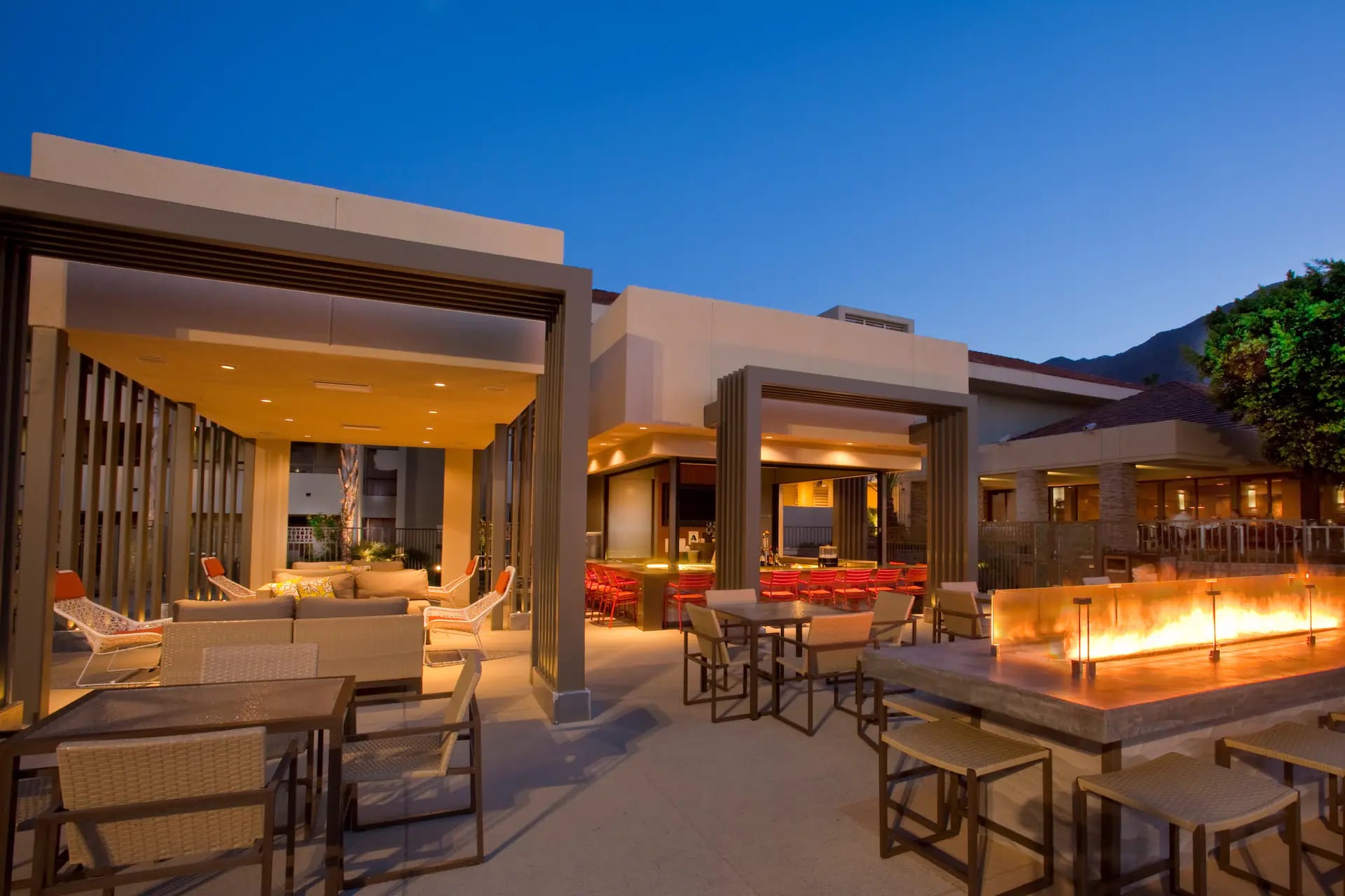 Outdoor seating and fire feature at Hilton Palm Springs AL FRESCO terrace